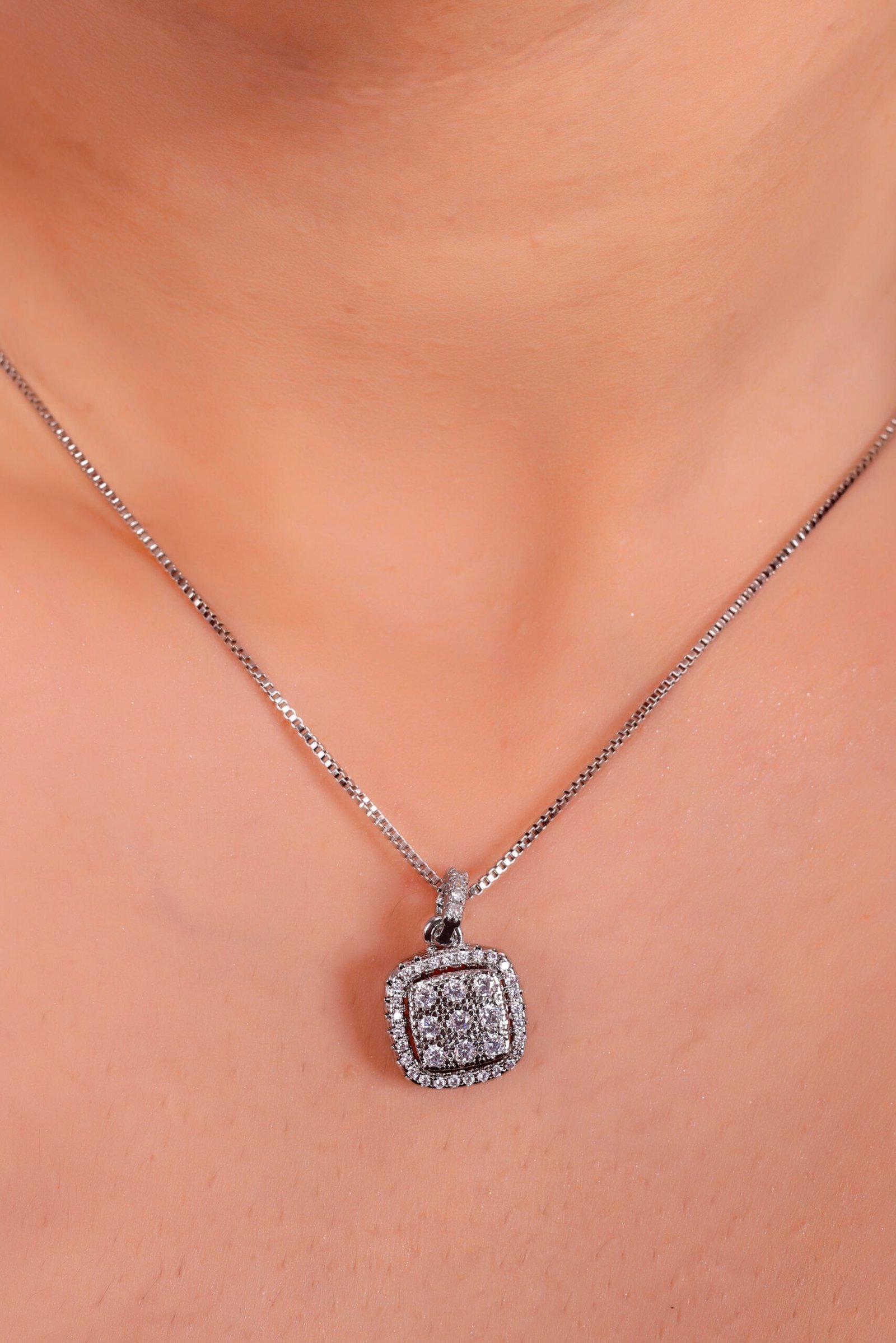 Elegant Diamond Pendant Necklace on Black Textured Background